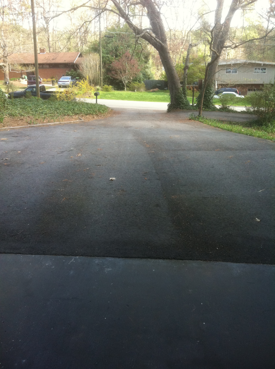 Parking lot with old, cracked asphalt